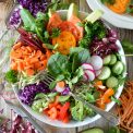 Vibrant, antioxidant-rich organic berries, wild salmon, and avocado arranged elegantly