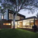 Minimalist luxury villa interior with completely invisible smart technology and flush-mount controls