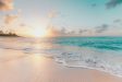 Pristine white sand beach with turquoise waters and luxury yachts anchored in Saint Barth?lemy